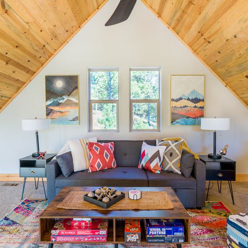 The a-frame loft is the ideal lounge space stocked with games, a dedicated workspace, and prime peak views of the rocky mountains!