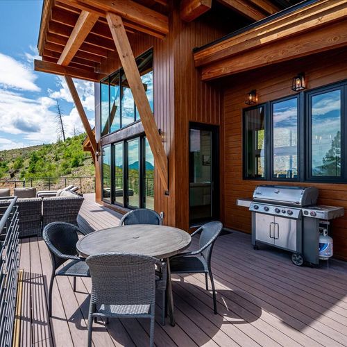 - fire up the grill and dine al fresco at the round table with sweeping views
- dream setup for casual bbqs or celebratory meals under open skies
- nestled beside the kitchen, this space makes outdoor cooking a breeze