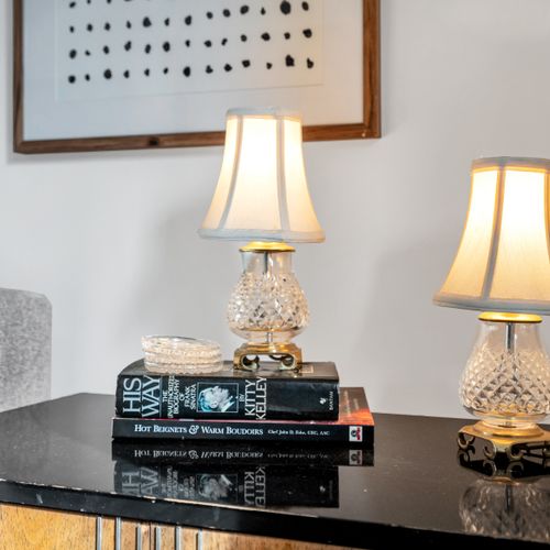 Inviting living area w/ a glowing lamp that sets a warm, relaxed mood.