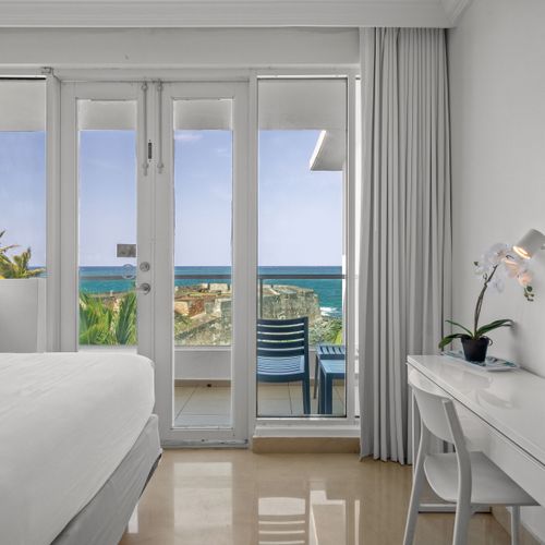 Rest in comfort and style in this beautifully appointed bedroom area. Two plush beds and elegant art ensure a peaceful night's sleep.