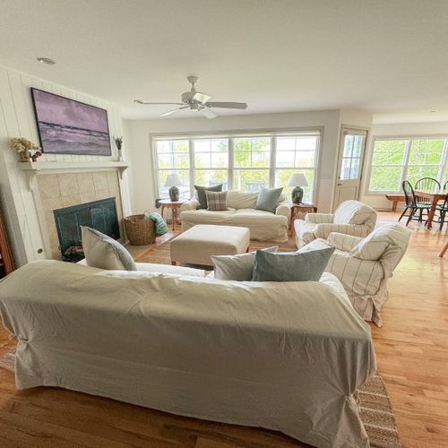 Living room:  the home has a super comfy living room with a wood fireplace and great view of the backyard, long lake, and sleeping bear dunes in the distance.