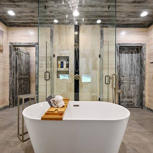 The bathroom has an oversized soaking tub as well as a walk-in shower.
