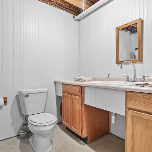 Bathroom #3 (lower level):  there is half-bathroom on the lower level.