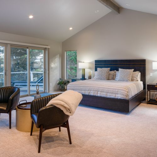 Amazing water views and a private balcony with sun loungers, fireplace and seating.