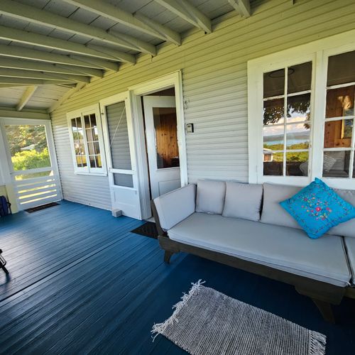 FRONT PORCH:   Very comfy fully enclosed front porch with a great view of Crystal Lake!