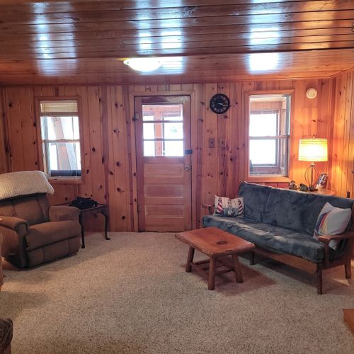 Living room:  very cozy and comfy living room with two sofas, two comfy chairs, a coffee table, and a gas fireplace.