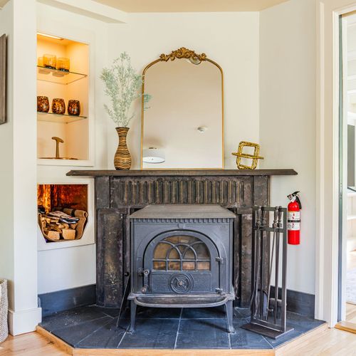 Snuggle up next to this classic wood stove, brimming with country charm.