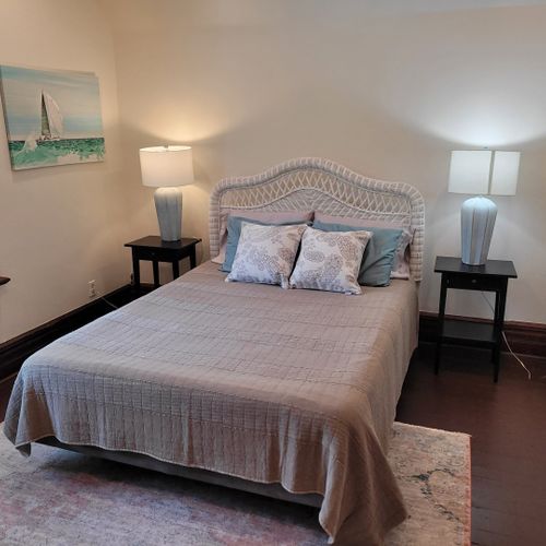 Bedroom #4 (second floor):  features a queen-size bed, dresser, television, nightstands, and a closet.