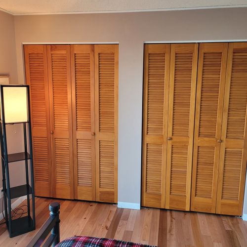 BEDROOM #2 (FIRST FLOOR):  Features a full-size bed, desk, streaming television, closet, private entrance, and a great view of Crystal Lake!