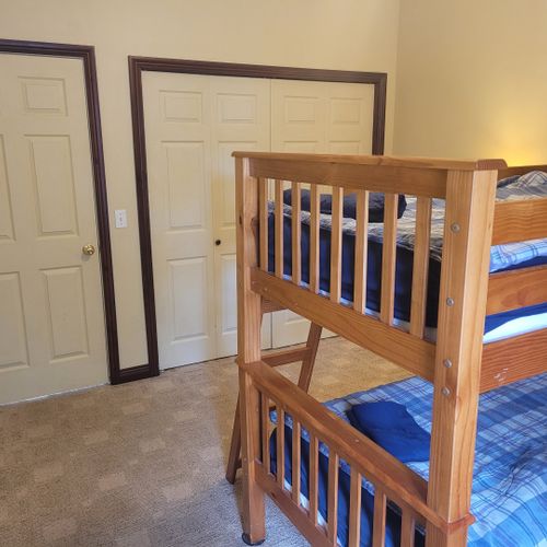 Bedroom #4 (lower level):  includes a twin-on-twin bunk bed, dresser, closet, nightstand, and lamps