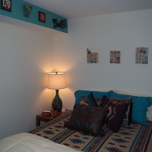 Bedroom:  very comfortable bedroom with a queen-size bed, ceiling fan, dresser, and mirror.