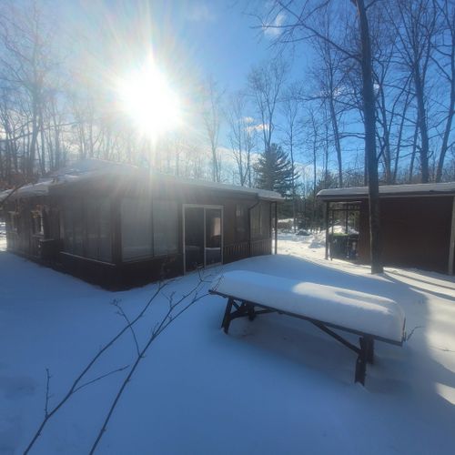 Exterior:  another view of the backyard, highlighting the outdoor picnic table.