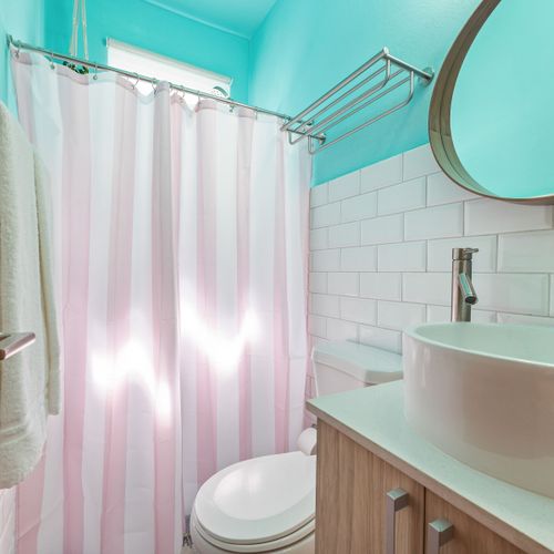 Step into a soothing shower experience with ample space and modern fixtures.