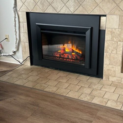 Living room:  the new electric fireplace that was installed in 2023.