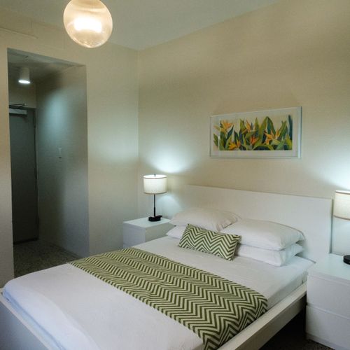 Designed for Your Comfort: This bright and airy room features a comfortable queen bed and convenient access, ensuring a seamless and enjoyable stay from the moment you arrive.
