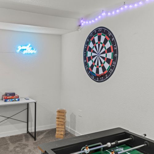 Game night on with jenga, board games, and darts for everyone.
