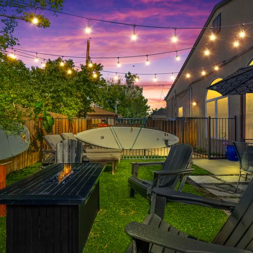 Private outdoor escape with firepit and loungers.