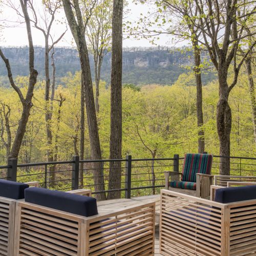 Back on the main level, step out onto the deck to marvel at the surrounding ridge and lake below.