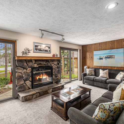 LIVING ROOM:  The large and beautiful living room with wood fireplace and walk-out to the bonfire ring