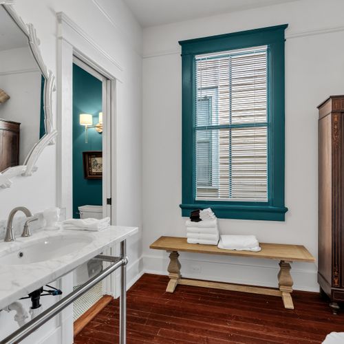 Bathroom vanity stocked w/ fresh linens & plenty of counter space.