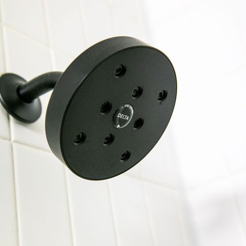 Sleek shower head for a refreshing rinse after a full day of exploring the city.