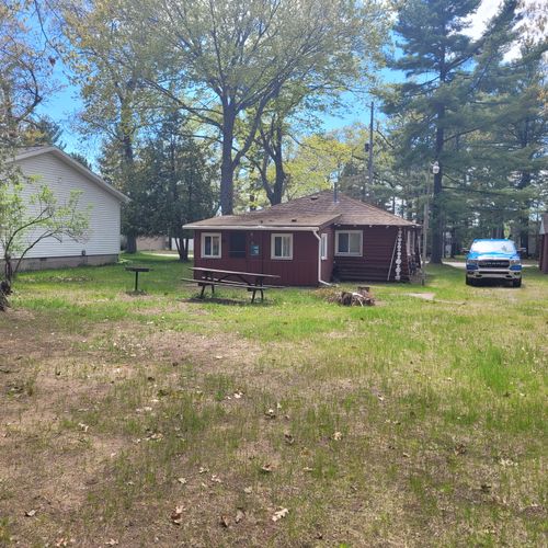 Exterior:  the large family-friendly backyard with picnic table, firepit, and charcoal grill