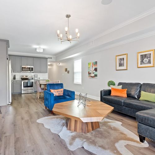 Open-concept front room blending kitchen & living space seamlessly.