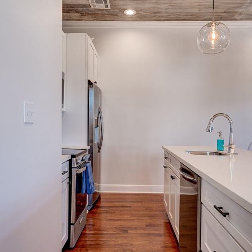 Well-equipped kitchen w/ stainless steel appliances & modern cabinetry.