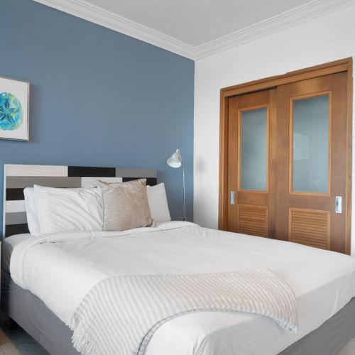 Rest easy in your cozy haven. Comfortable queen bed & thoughtful design ensure a peaceful night's sleep.