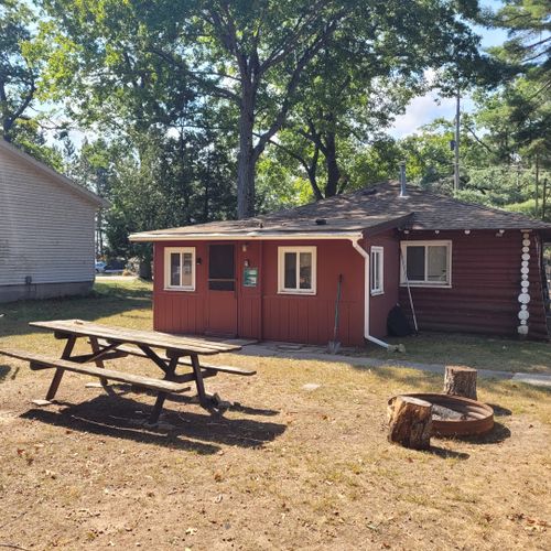 Exterior:  the large family-friendly backyard with picnic table, firepit, and charcoal grill