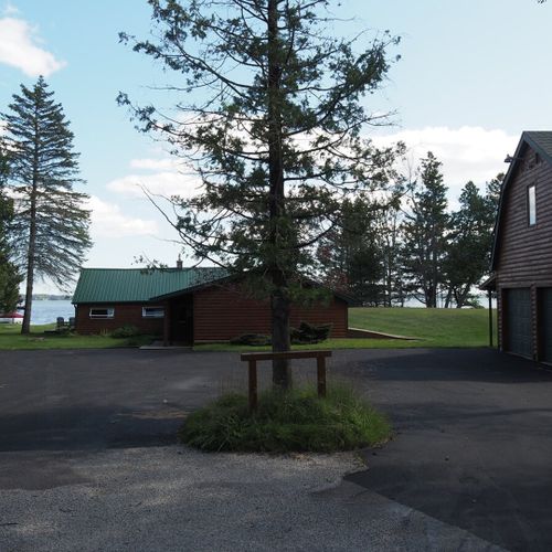 Exterior:  the large parking area in front of the house. (note that guests are not permitted to access the detached garage. )