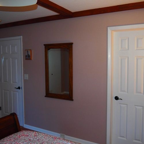 Bedroom #1 (second floor):  features a queen-size bed, nightstands, dresser, ceiling fan, closet, and a private entrance to the second floor bathroom.