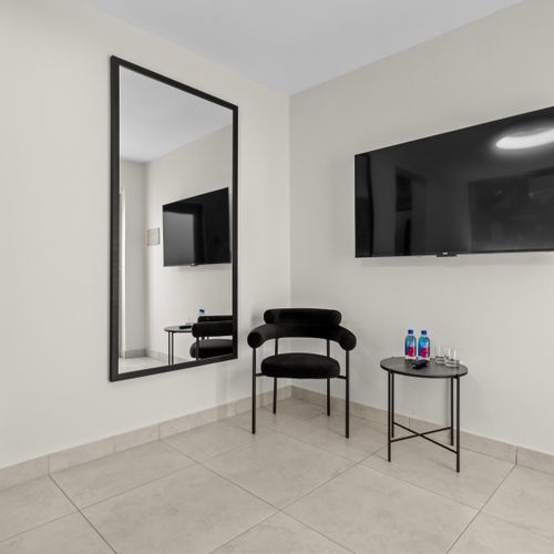A comfortable seating area and a large TV for entertainment.