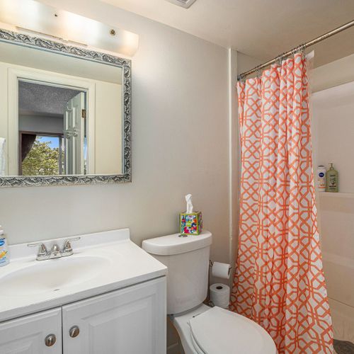 Refresh in the ensuite walk-in shower—minimalist, clean, and effortlessly calming.