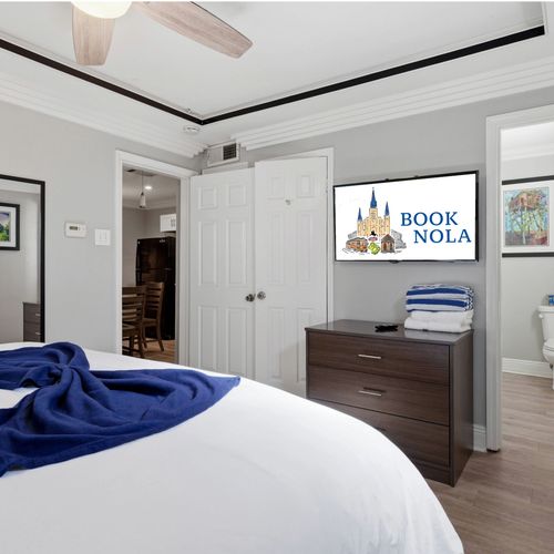 Cozy bedroom corner w/ soft bedding & a calm, neutral palette for easy rest.