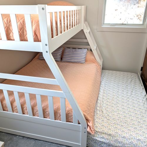 BEDROOM #2 (MAIN FLOOR):  Photo showing the trundle bed moved out from under the bunk bed.