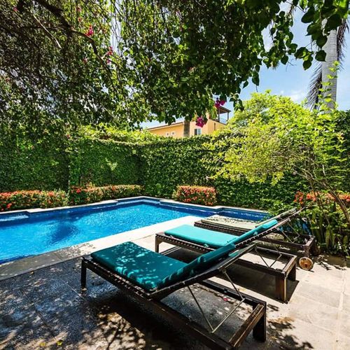 The pool area is shared with all 5 condominiums.
