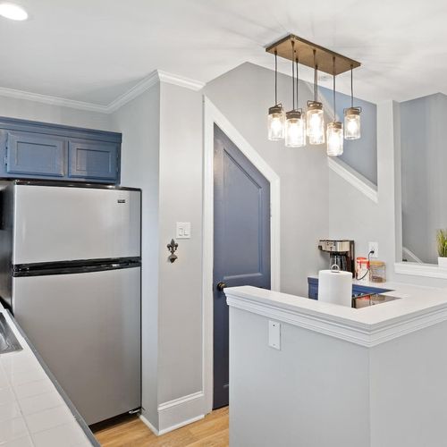 Fully stocked kitchen w/ fridge & bright, functional layout.