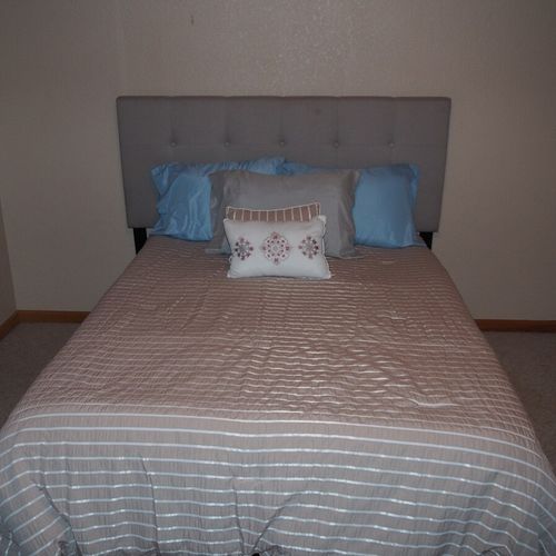 Bedroom #3 (upstairs):  features a full-size bed, dresser, and closet.