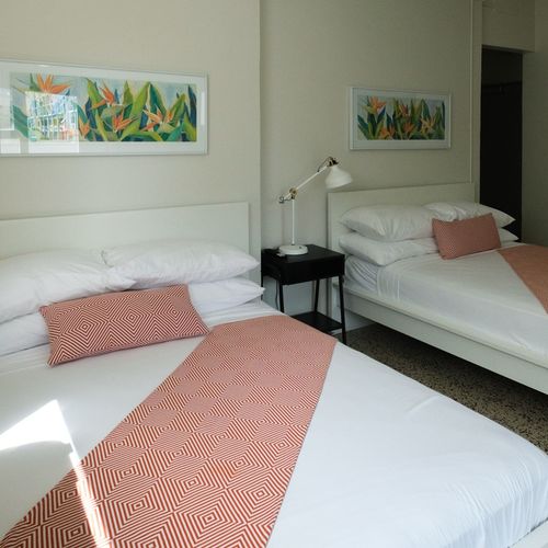 Unwind in a serene setting! This comfortable bedroom is thoughtfully decorated to provide a calming ambiance, ensuring a peaceful and enjoyable stay.