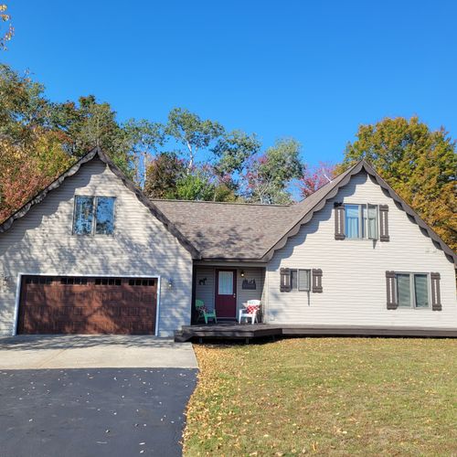 EXTERIOR:  The front of the house in early Fall.