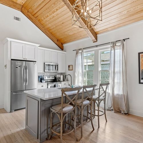 Kitchen & dining area w/ refrigerator, microwave & oven/stove ready to use.
