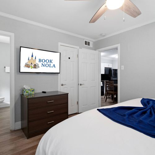 Sun-filled bedroom w/ a comfortable bed & serene atmosphere.