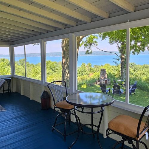 OVERVIEW:  Looking out on Crystal Lake from the gorgeous fully-enclosed front porch.