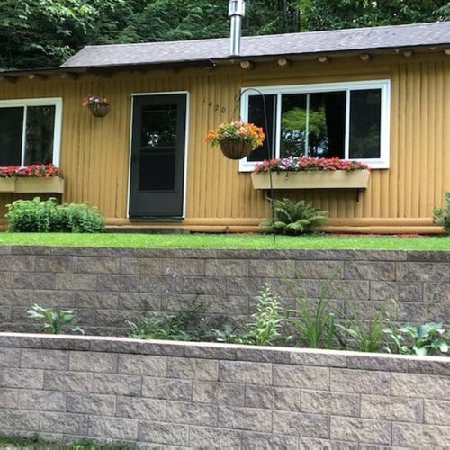 Overall:  the front of the cabin in the summer.