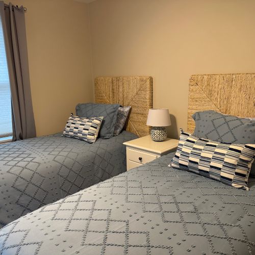 Bedroom #3:  features 2 matching twin beds, ceiling fan, closet, nightstand, and lamp