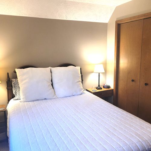 BEDROOM #3 (SECOND FLOOR):  Comfy bed with a queen-size bed, nightstand, ceiling fan, dresser, and closet.