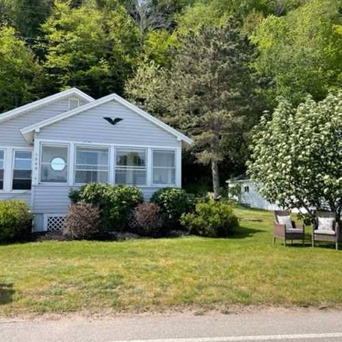 Exterior:  the front of the cottage in summer.