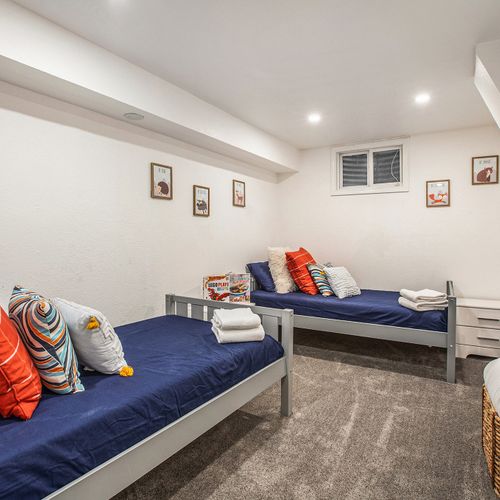 This lower level room with its two twin beds is the ideal spot for teens or single travelers looking for a private space of their own.