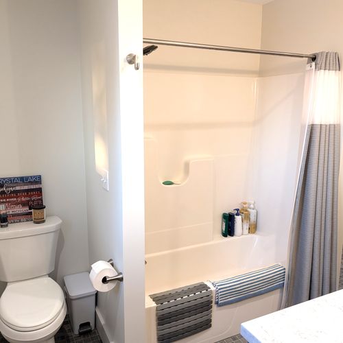 BATHROOM #2 (UPPER LEVEL):  Full bathroom on the top floor (third floor) with a combination tub and shower.  Includes private entrance from the top floor bathroom as well as a washer and dryer in a laundry closet.